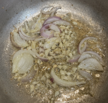 Heat cooking oil in a deep pan or wok over medium heat. Add the garlic and onion, then sauté until fragrant and softened.