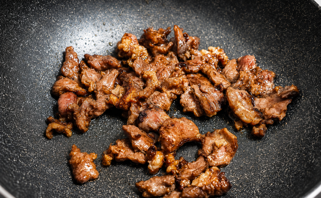Heat oil in a large pot over medium heat. Add the beef and cook until browned on all sides.