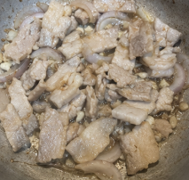 Add the sliced pork and cook for about 3 to 5 minutes, or until lightly browned.