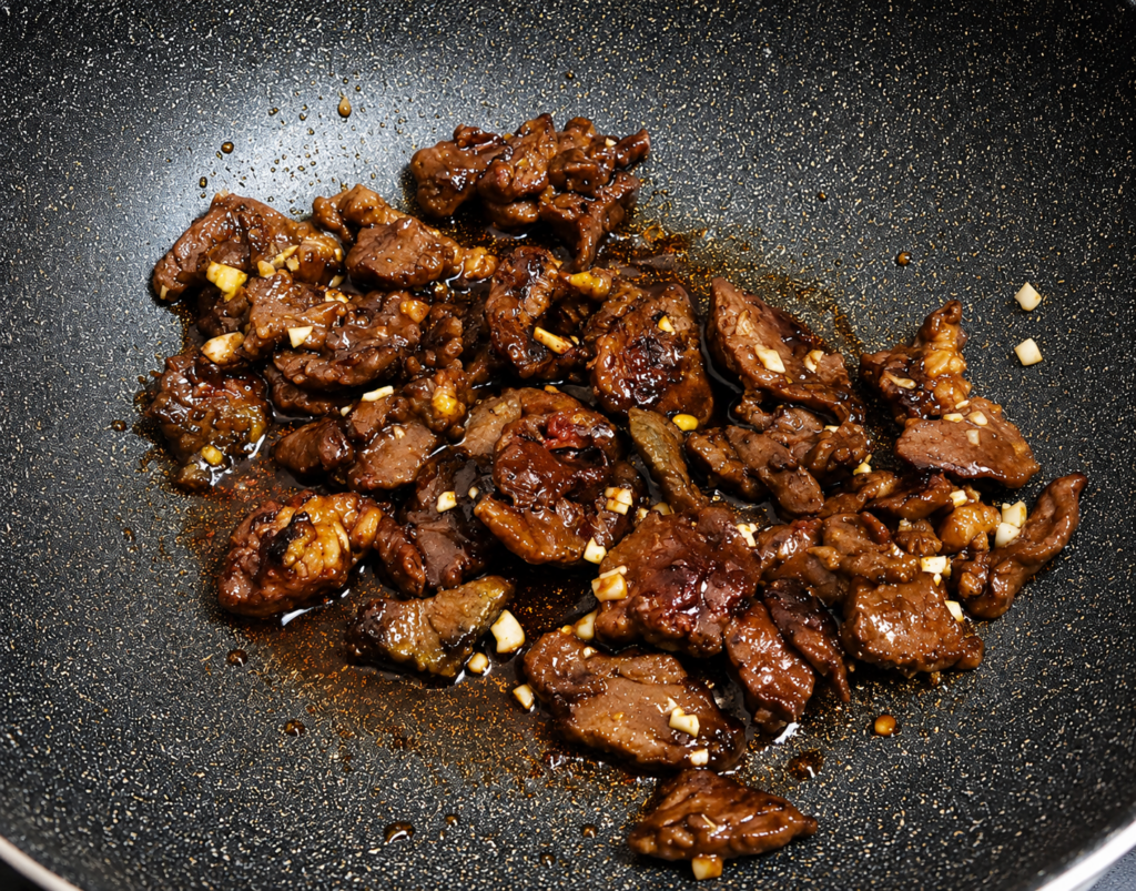 Add the garlic and soy sauce. Stir well for about 1 minute until fragrant.