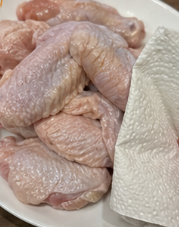 Pat the chicken wings or drumettes dry with paper towels. This helps them crisp up better.