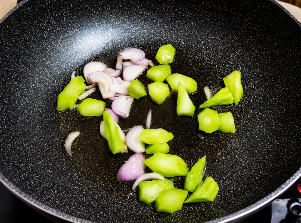 While the beef cooks, heat a separate pan with a little oil. Stir-fry the onions, carrots, celery, bell peppers, and pechay one at a time until crisp-tender.