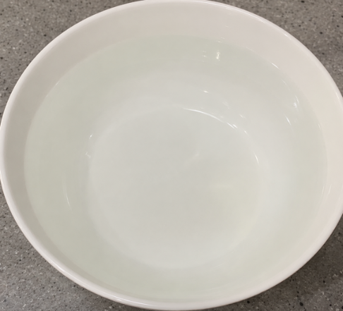 Fill a large bowl with lukewarm water. This will help the fish balls hold their shape before cooking.