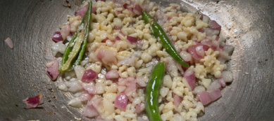 Add margarine to the achuete oil. Sauté the onion, garlic, and green chilies until fragrant.