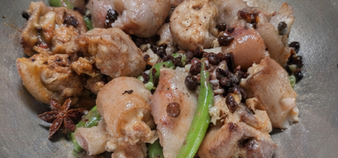 Add the tender ox feet, star anise, and fermented black beans. Stir well so the meat absorbs the flavor.