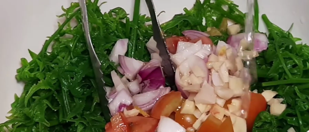 Drizzle olive oil and vinegar over the salad.