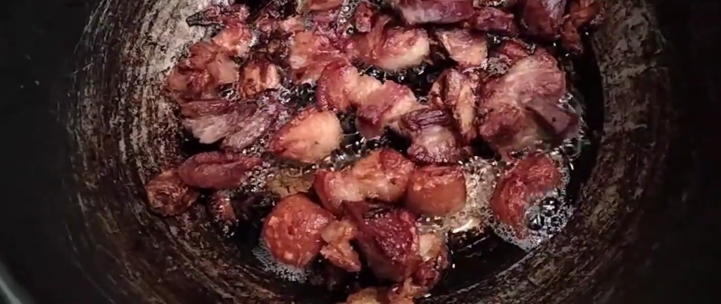 Once the liquid is almost gone, allow the pork to cook in its own oil.