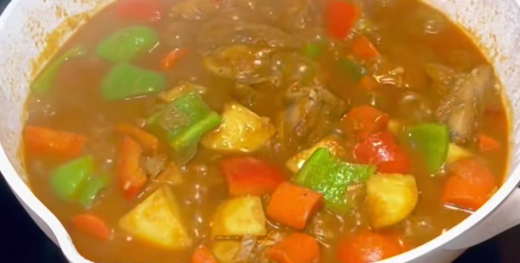 Add the fried potatoes and carrots back into the pan. Cook for 5 to 7 minutes. Season with salt and ground black pepper, then serve hot.