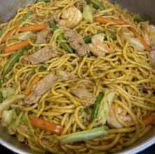 Continue cooking until the noodles are soft and most of the liquid has been absorbed. If the noodles are still firm, add a small amount of water and cook a little longer. Transfer to a serving plate and serve warm.