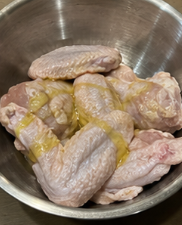 Place the chicken in a bowl and toss with olive oil until lightly coated.