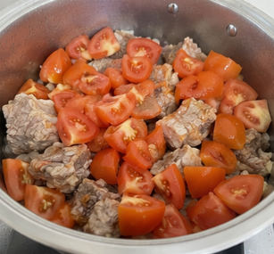 Add the chopped tomatoes and cook until they soften.