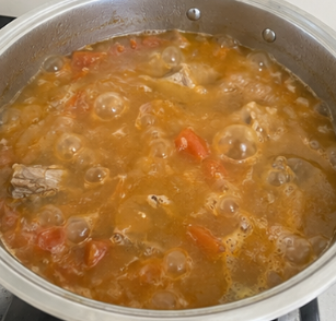 Reduce the heat, cover, and simmer for 60 minutes, or until the pork becomes tender. Add extra water if needed.