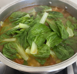 Add the pechay and cook for 1 to 2 minutes.