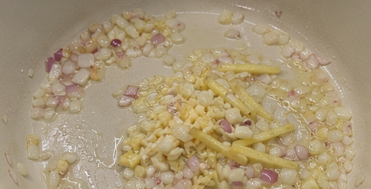 Heat the cooking oil in a large pan over medium heat. Sauté the onion until soft, then add the garlic and ginger.