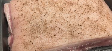 Season the pork evenly with salt, garlic powder, and black pepper, making sure all surfaces are well coated.