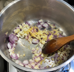 Heat 3 tablespoons of cooking oil in a large pot over medium heat. Add the onion, garlic, and remaining ginger. Sauté until the onion becomes soft and fragrant.